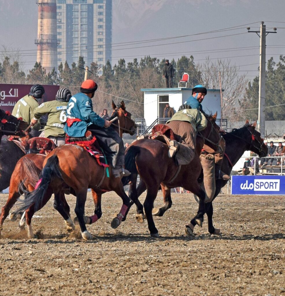 Riders compete in a thrilling Buzkashi match in Kabul, showcasing Afghan culture and equestrian skill.
