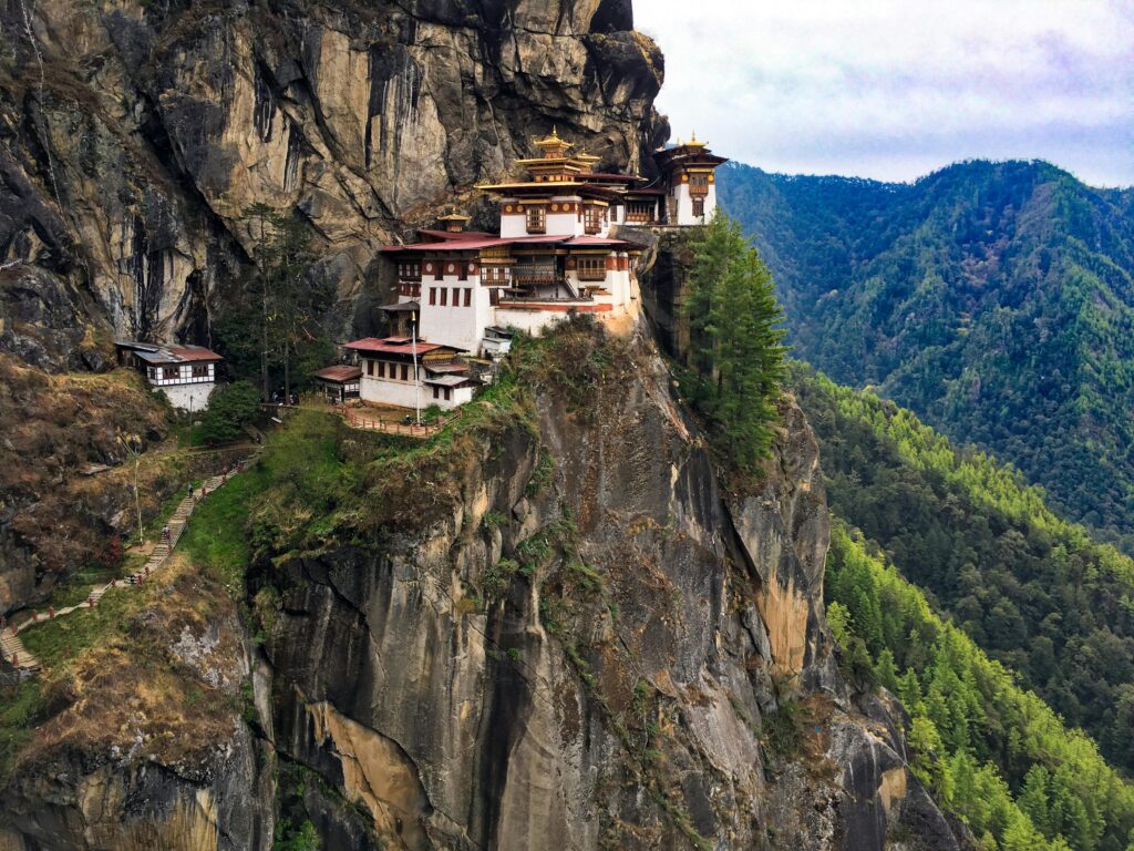 pexels-photo-910368-910368 A breathtaking view of the iconic Tiger's Nest Monastery perched on a cliff in Bhutan's lush landscape.