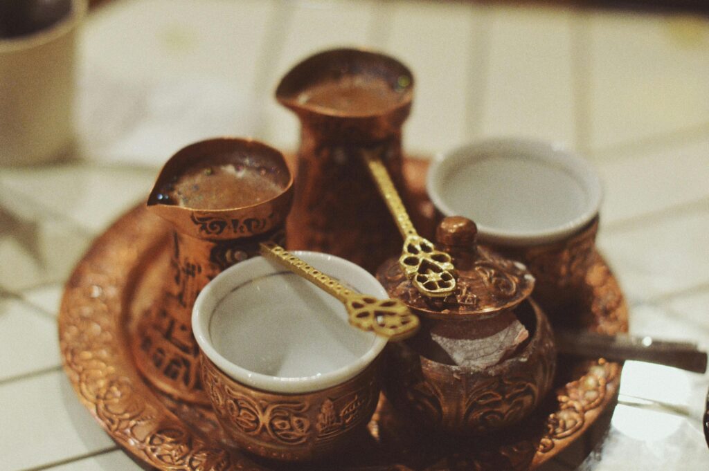 pexels-photo-29056089-29056089 A classic Bosnian coffee set featuring ornate brassware and cups, capturing cultural essence.